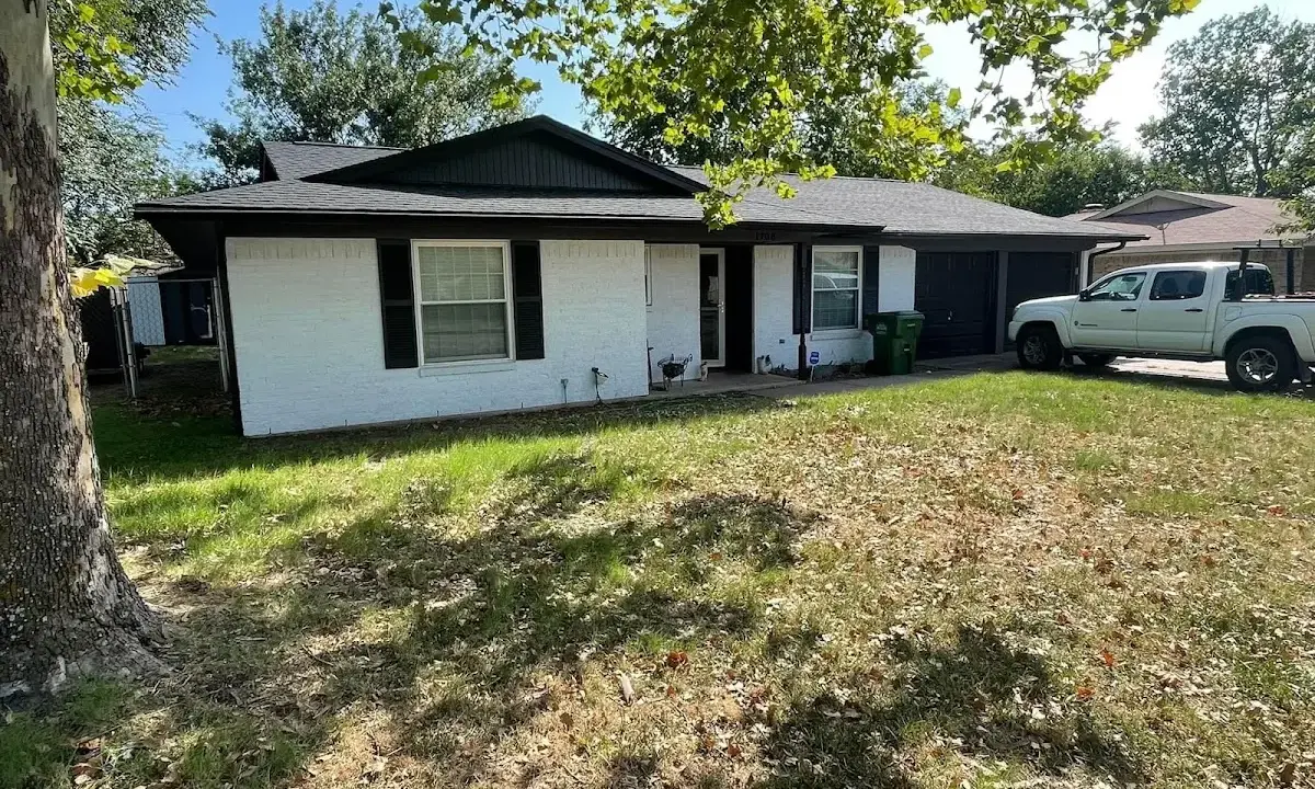 Professional roofing crew working on a residential roof in Butler